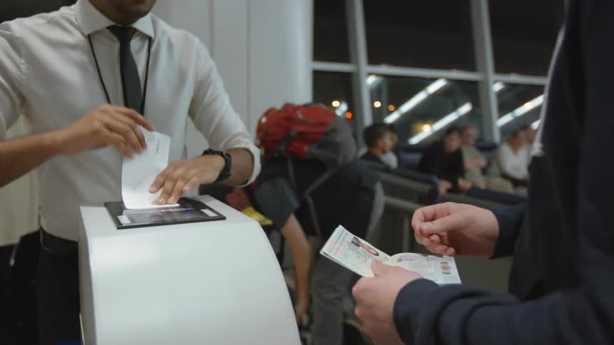Traveler getting a ticket stub to board a plane