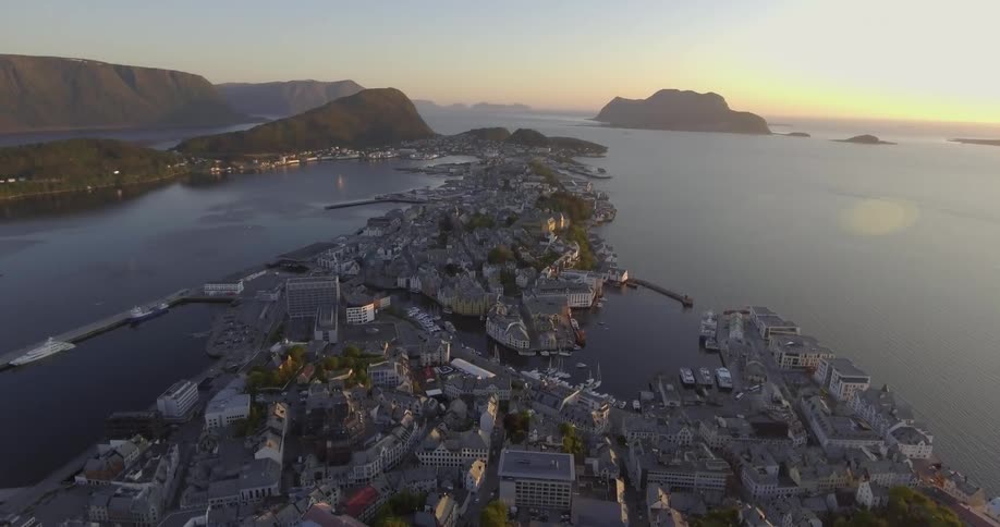 Aerial view of a port town at sunset
