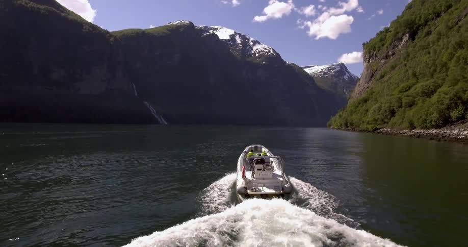 A boat is moving fast over a lake