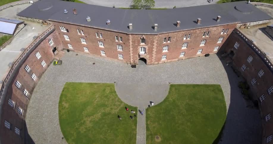 A building with people in the yard