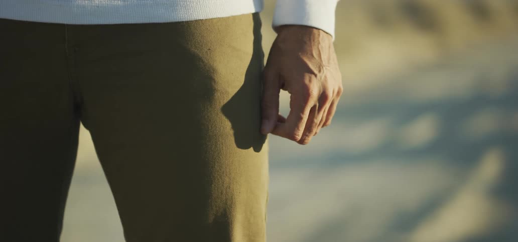 A person is standing at the beach