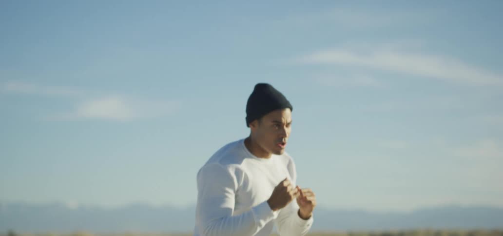 A man is exercising outdoors during the day