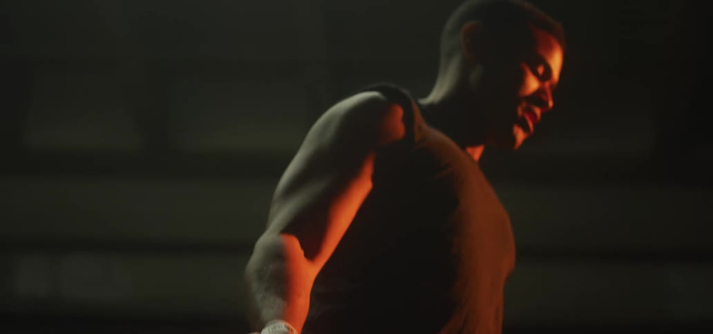 A man is jumping rope at night