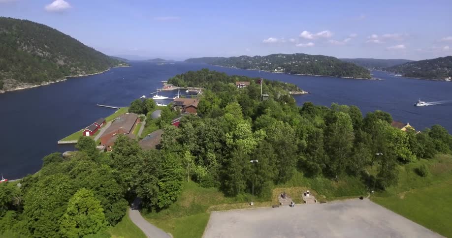 Homes and trees sit near a body of water