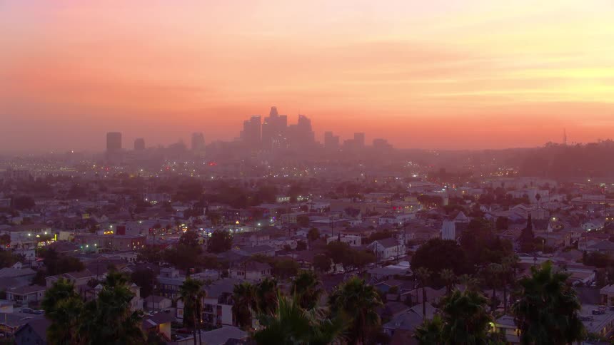 Heavy smog covers the buildings of the city