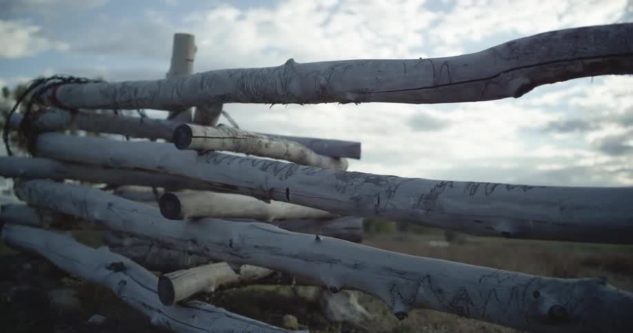 White wooden fence on the fields in the grassland at day time
