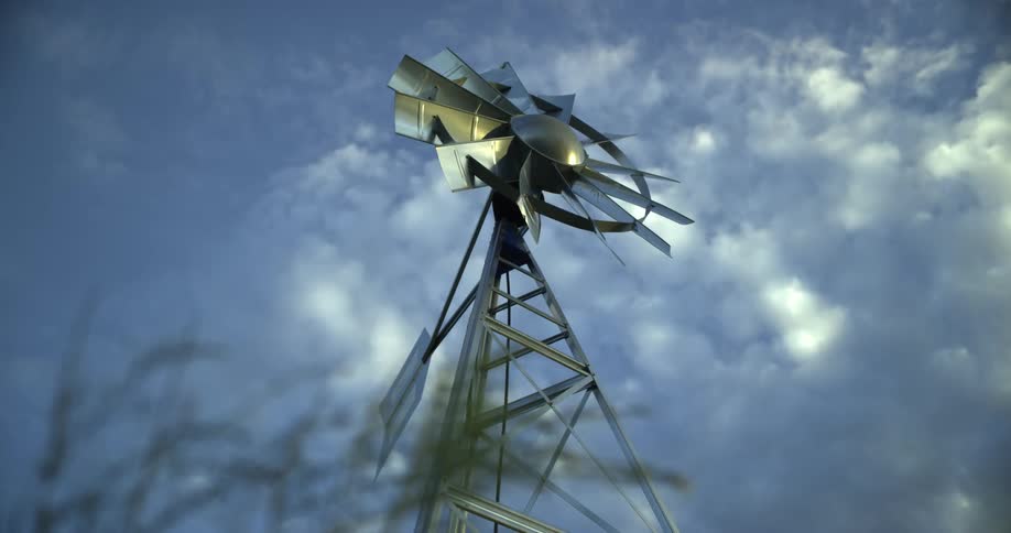 A windmill under a cloudy sky