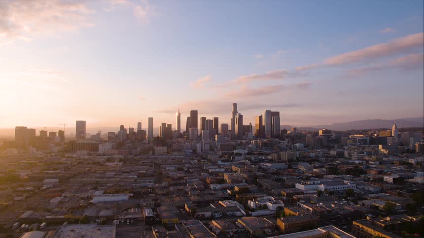 Skyscrapers loom over Los Angeles at sunset