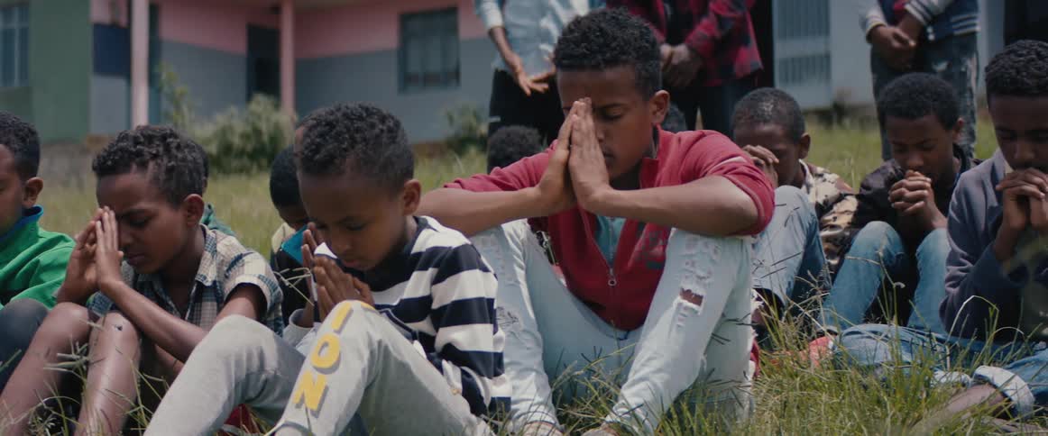 Children pay outside of the school