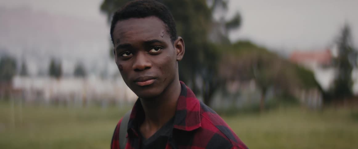 A man standing and looking into the distance