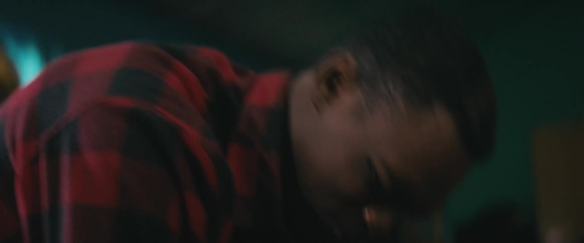 Two men are fighting on the ground