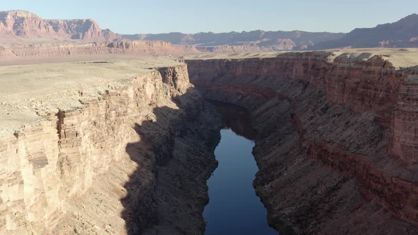 A river flowing inside a canyon in the mesa on the badlands