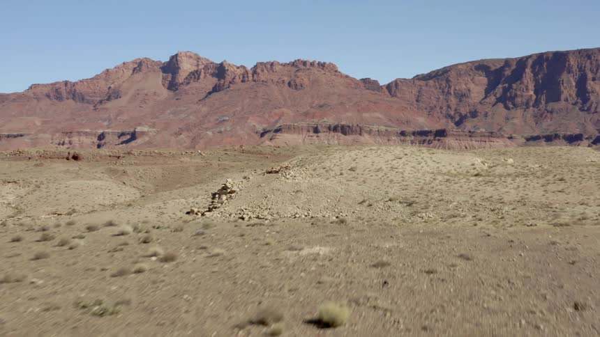 A view of mountains in the horizon is displayed