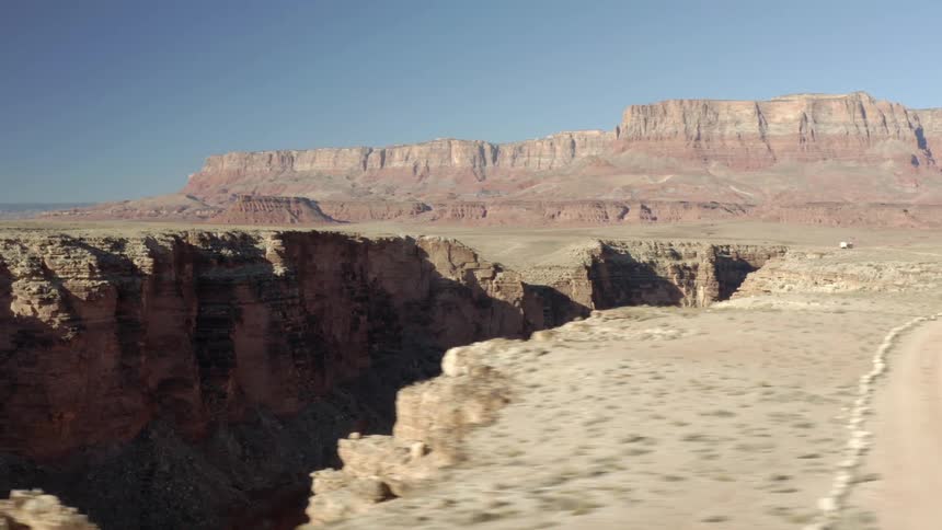 An aerial view of a large canyon in a desert