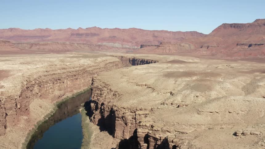 An aerial landscape view of a river and mountains at daytime