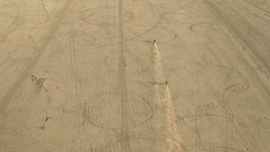 Motorcycles in aerial view on a dirt