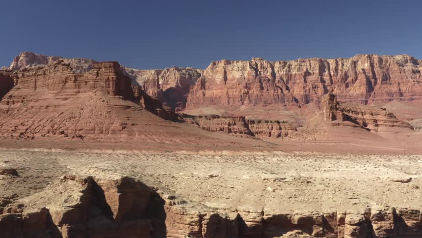 Aerial view of the eroded steep cliffs of the mesas on the desert badlands