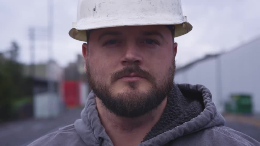 A man standing in front of a road