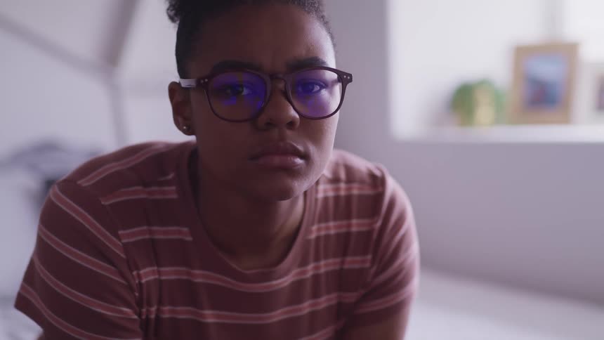 Girl looking up in a stern manner