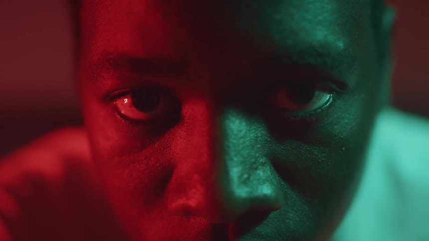 A closeup view of a mans face is displayed