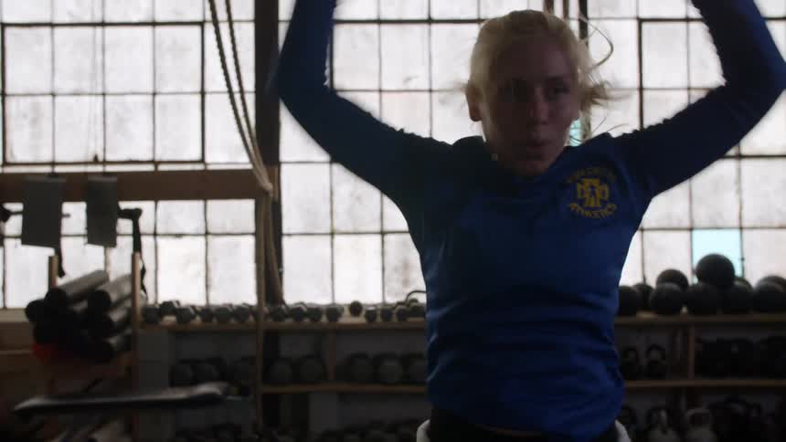 A woman exercising in a gym