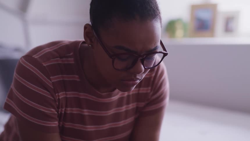 A woman is leaning down in the room