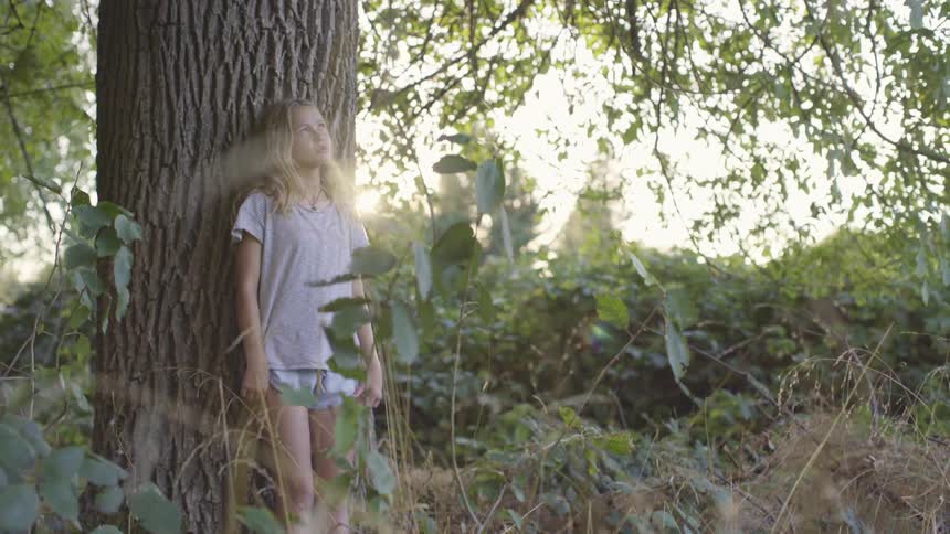 A teenager looking into the sky