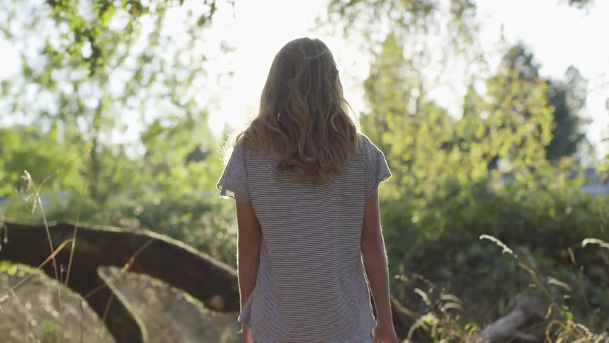 A woman walking in a forest