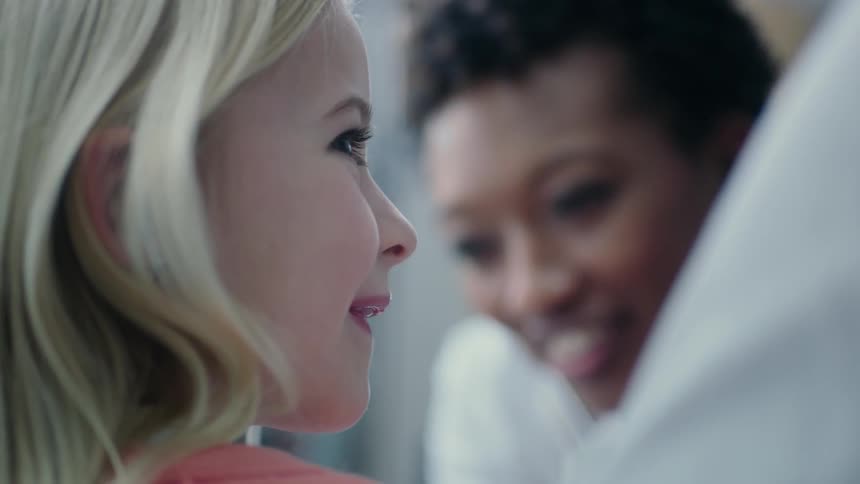 A female doctor is shown with a female child patient