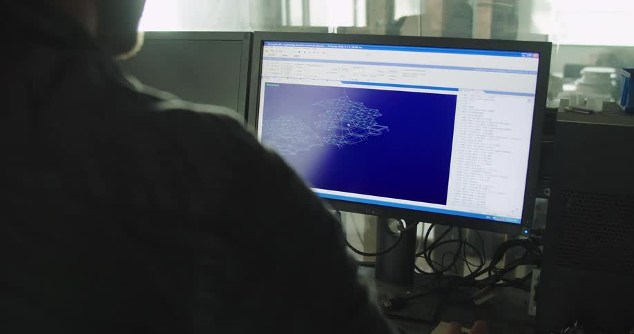 A man works on a computer in an office