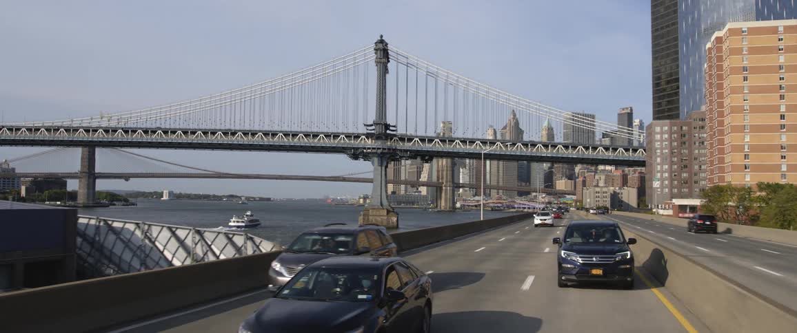 Traveling on the highway along the hudson river with new york city in the background