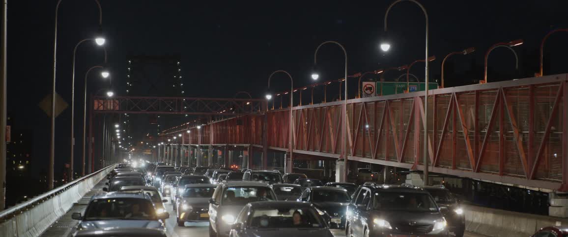 Vehicles driving across a bridge in the city