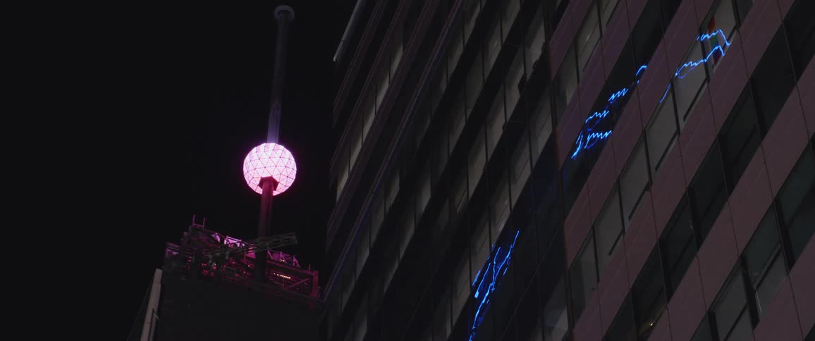A tight shot of a ball on top of a tower