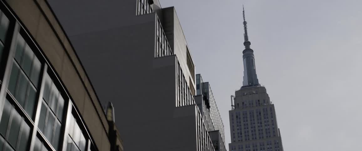 A tight shot of the tops of buildings from the ground