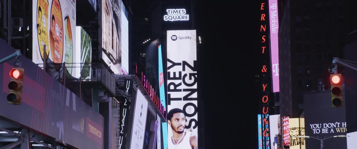 Times square with billboards and big street at night