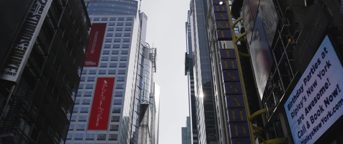 Tall city skyscrapers towering overhead in the daytime