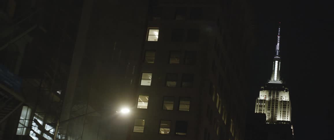 The building is brightly lit at night
