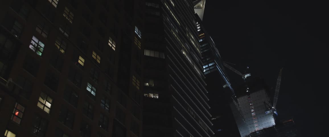 Tall skyscrapers in the citys downtown at night