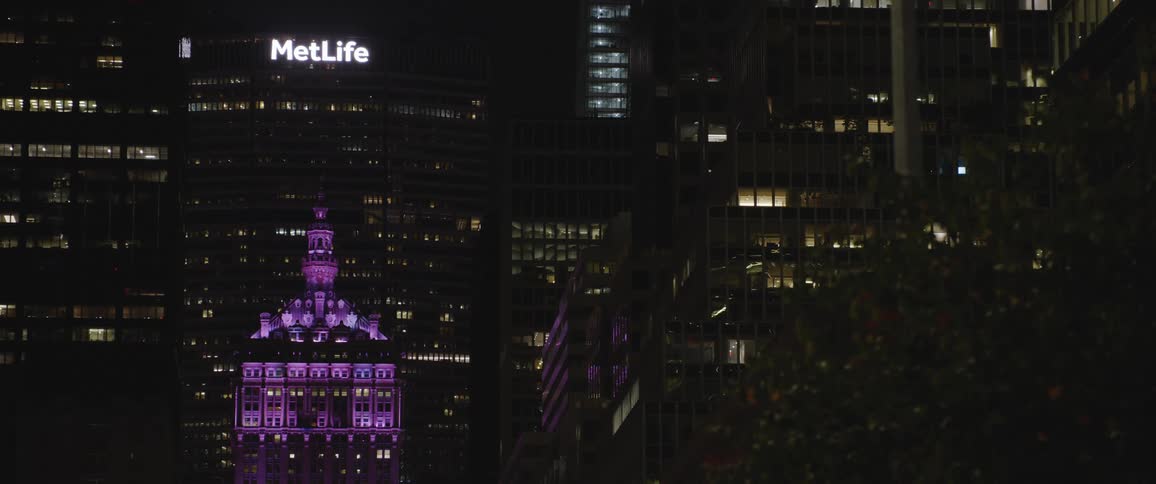 New york city skyscrapers at nighttime with a view of the metlife building in the distance