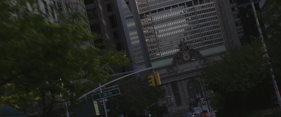 Twisting aerial footage of a city street in the citys downtown at morning