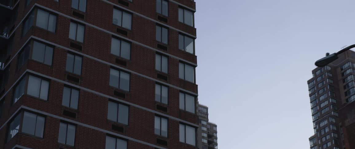 Tall apartment buildings in the citys downtown at sunset