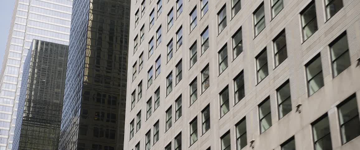 Sunlight shines and reflects on city buildings