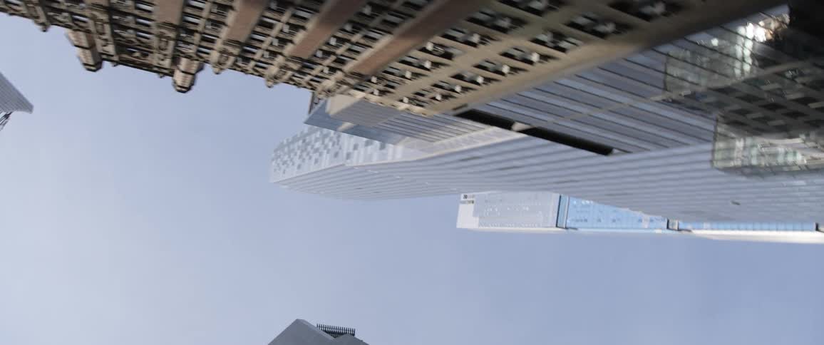 Downtown area with buildings and skyscrapers from the street view up to sky