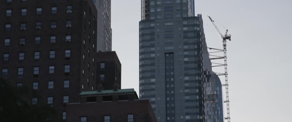 A very tall building is under construction in the city