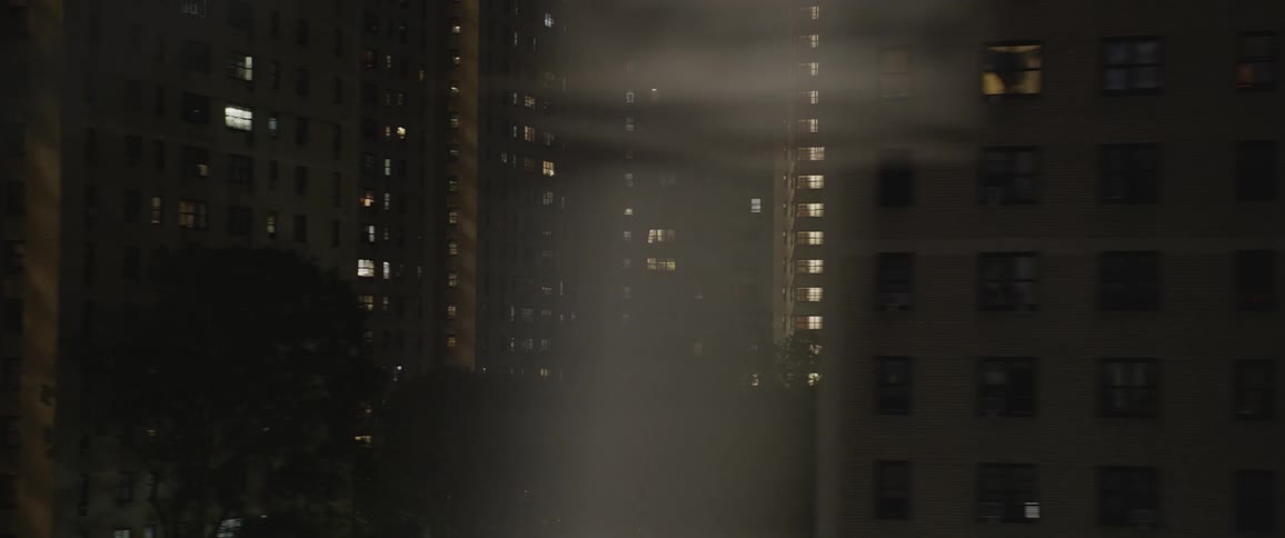 Aerial view of high rise buildings and condominiums at night