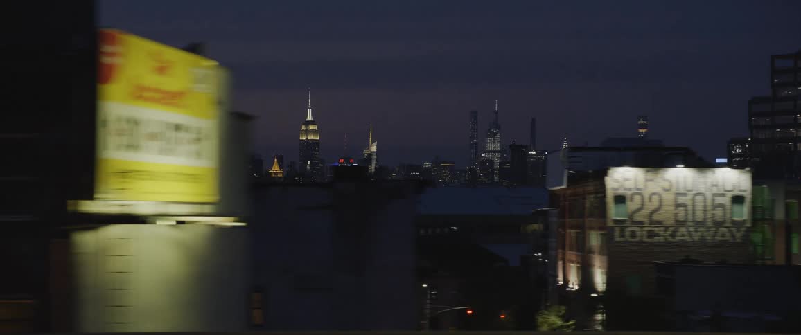 City skyline with illuminated high rise buildings and skyscrapers at night