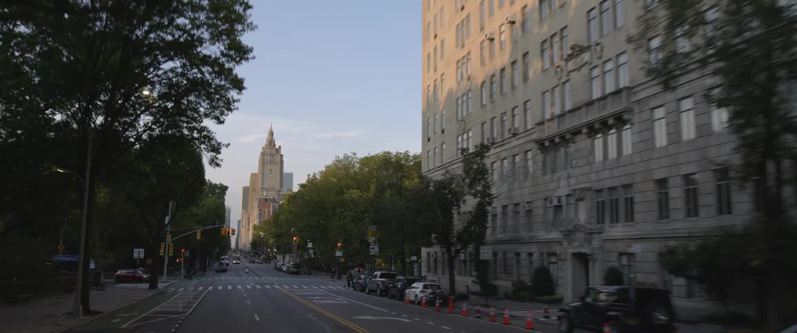 Cars are driving in a downtown city