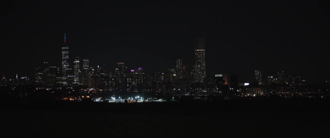 City skyline at night with city lights shining