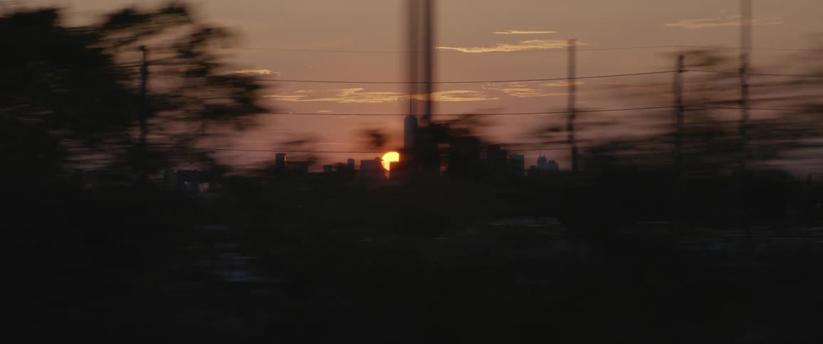 Moving along power lines on the outskirts of a city