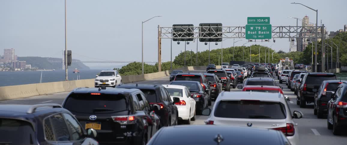 Commuters driving in traffic on the highway in the city